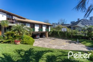 Casa em Condomínio à venda com 600m², 4 dormitórios, 4 suítes, 6 vagas, no bairro Cavalhada em PORTO ALEGRE