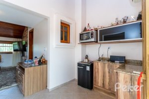 Casa em Condomínio à venda com 153m², 3 dormitórios, 1 suíte, 2 vagas, no bairro Tristeza em Porto Alegre