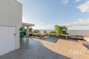 Casa à venda com 524m², 4 dormitórios, 4 suítes, 4 vagas, no bairro Vila Assunção em Porto Alegre