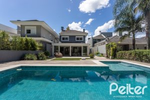 Casa em Condomínio à venda com 233m², 3 dormitórios, 3 suítes, 4 vagas, no bairro Terra Ville em PORTO ALEGRE