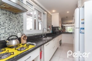 Casa em Condomínio à venda com 233m², 3 dormitórios, 3 suítes, 4 vagas, no bairro Terra Ville em PORTO ALEGRE