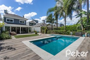 Casa em Condomínio à venda com 233m², 3 dormitórios, 3 suítes, 4 vagas, no bairro Terra Ville em PORTO ALEGRE