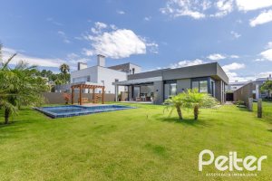 Casa em Condomínio à venda com 370m², 3 dormitórios, 3 suítes, 4 vagas, no bairro Terra Ville em PORTO ALEGRE