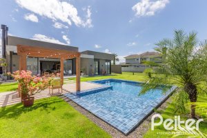 Casa em Condomínio à venda com 370m², 3 dormitórios, 3 suítes, 4 vagas, no bairro Terra Ville em PORTO ALEGRE