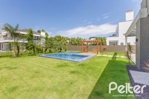 Casa em Condomínio à venda com 370m², 3 dormitórios, 3 suítes, 4 vagas, no bairro Terra Ville em PORTO ALEGRE