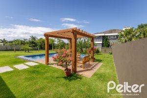 Casa em Condomínio à venda com 370m², 3 dormitórios, 3 suítes, 4 vagas, no bairro Terra Ville em PORTO ALEGRE