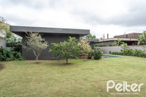 Casa em Condomínio à venda com 327m², 3 dormitórios, 3 suítes, 4 vagas, no bairro Terra Ville em PORTO ALEGRE