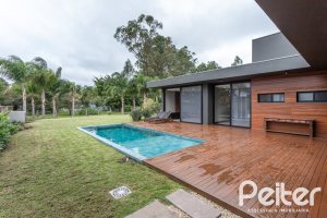 Casa em Condomínio à venda com 327m², 3 dormitórios, 3 suítes, 4 vagas, no bairro Terra Ville em PORTO ALEGRE