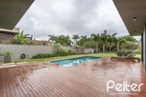 Casa em Condomínio à venda com 327m², 3 dormitórios, 3 suítes, 4 vagas, no bairro Terra Ville em PORTO ALEGRE