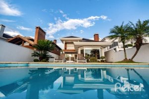 Casa em Condomínio à venda com 338m², 3 dormitórios, 3 suítes, 2 vagas, no bairro Terra Ville em PORTO ALEGRE