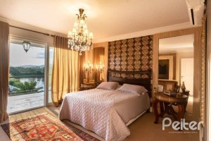 Casa em Condomínio à venda com 338m², 3 dormitórios, 3 suítes, 2 vagas, no bairro Terra Ville em PORTO ALEGRE