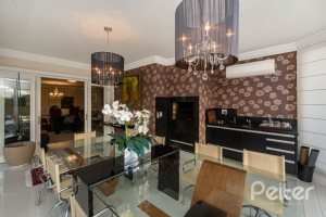 Casa em Condomínio à venda com 338m², 3 dormitórios, 3 suítes, 2 vagas, no bairro Terra Ville em PORTO ALEGRE