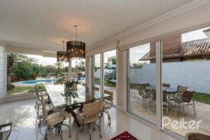 Casa em Condomínio à venda com 338m², 3 dormitórios, 3 suítes, 2 vagas, no bairro Terra Ville em PORTO ALEGRE