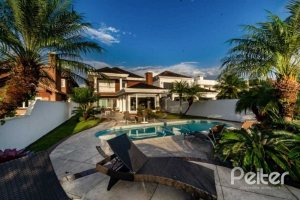Casa em Condomínio à venda com 338m², 3 dormitórios, 3 suítes, 2 vagas, no bairro Terra Ville em PORTO ALEGRE