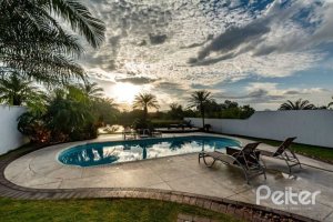 Casa em Condomínio à venda com 338m², 3 dormitórios, 3 suítes, 2 vagas, no bairro Terra Ville em PORTO ALEGRE