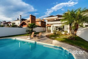 Casa em Condomínio à venda com 338m², 3 dormitórios, 3 suítes, 2 vagas, no bairro Terra Ville em PORTO ALEGRE