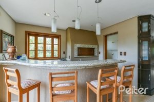 Casa em Condomínio à venda com 320m², 4 dormitórios, 4 suítes, 10 vagas, no bairro Cavalhada em PORTO ALEGRE