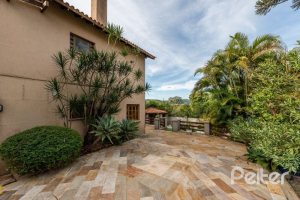 Casa em Condomínio à venda com 320m², 4 dormitórios, 4 suítes, 10 vagas, no bairro Cavalhada em PORTO ALEGRE