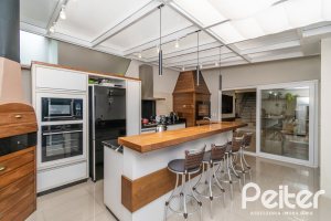 Casa em Condomínio à venda com 240m², 4 dormitórios, 2 suítes, 2 vagas, no bairro Tristeza em Porto Alegre