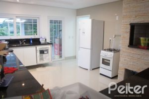 Casa em Condomínio à venda com 263m², 3 dormitórios, 1 suíte, 3 vagas, no bairro Mountain Ville em PORTO ALEGRE