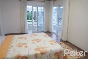 Casa em Condomínio à venda com 263m², 3 dormitórios, 1 suíte, 3 vagas, no bairro Mountain Ville em PORTO ALEGRE