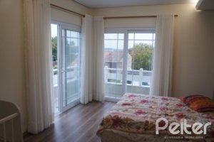 Casa em Condomínio à venda com 263m², 3 dormitórios, 1 suíte, 3 vagas, no bairro Mountain Ville em PORTO ALEGRE