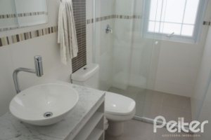 Casa em Condomínio à venda com 263m², 3 dormitórios, 1 suíte, 3 vagas, no bairro Mountain Ville em PORTO ALEGRE