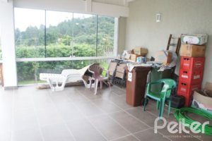 Casa em Condomínio à venda com 263m², 3 dormitórios, 1 suíte, 3 vagas, no bairro Mountain Ville em PORTO ALEGRE