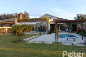 Casa em Condomínio à venda com 392m², 3 dormitórios, 1 suíte, 2 vagas, no bairro Terra Ville em Porto Alegre