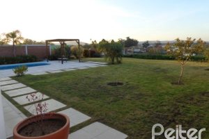 Casa em Condomínio à venda com 392m², 3 dormitórios, 1 suíte, 2 vagas, no bairro Terra Ville em Porto Alegre