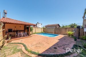 Casa à venda com 436m², 4 dormitórios, 4 suítes, 5 vagas, no bairro Vila Assunção em Porto Alegre