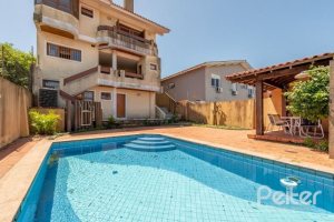 Casa à venda com 436m², 4 dormitórios, 4 suítes, 5 vagas, no bairro Vila Assunção em Porto Alegre