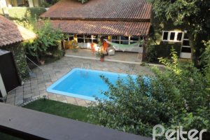 Casa à venda com 500m², 4 dormitórios, 3 suítes, 4 vagas, no bairro Tristeza em Porto Alegre