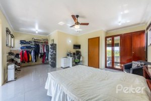 Casa em Condomínio à venda com 234m², 3 dormitórios, 3 suítes, 3 vagas, no bairro Hípica em Porto Alegre