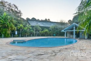 Casa em Condomínio à venda com 450m², 6 dormitórios, 4 suítes, 2 vagas, no bairro Terra Ville em Porto Alegre