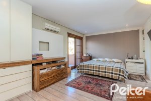 Casa em Condomínio à venda com 450m², 6 dormitórios, 4 suítes, 2 vagas, no bairro Terra Ville em PORTO ALEGRE