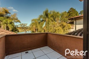 Casa em Condomínio à venda com 450m², 6 dormitórios, 4 suítes, 2 vagas, no bairro Terra Ville em PORTO ALEGRE