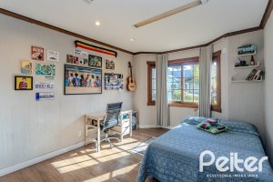 Casa em Condomínio à venda com 450m², 6 dormitórios, 4 suítes, 2 vagas, no bairro Terra Ville em PORTO ALEGRE
