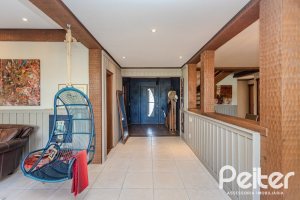Casa em Condomínio à venda com 450m², 6 dormitórios, 4 suítes, 2 vagas, no bairro Terra Ville em PORTO ALEGRE
