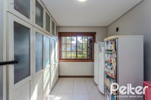 Casa em Condomínio à venda com 450m², 6 dormitórios, 4 suítes, 2 vagas, no bairro Terra Ville em PORTO ALEGRE