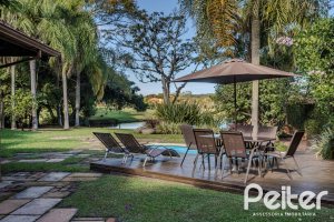 Casa em Condomínio à venda com 450m², 6 dormitórios, 4 suítes, 2 vagas, no bairro Terra Ville em PORTO ALEGRE