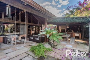 Casa em Condomínio à venda com 450m², 6 dormitórios, 4 suítes, 2 vagas, no bairro Terra Ville em PORTO ALEGRE