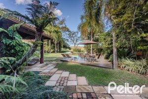Casa em Condomínio à venda com 450m², 6 dormitórios, 4 suítes, 2 vagas, no bairro Terra Ville em PORTO ALEGRE