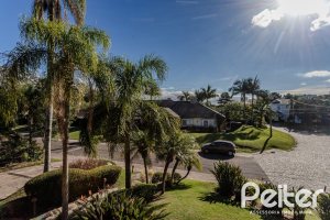 Casa em Condomínio à venda com 450m², 6 dormitórios, 4 suítes, 2 vagas, no bairro Terra Ville em PORTO ALEGRE