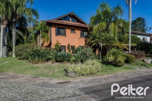 Casa em Condomínio à venda com 450m², 6 dormitórios, 4 suítes, 2 vagas, no bairro Terra Ville em PORTO ALEGRE