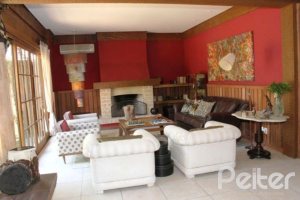 Casa em Condomínio à venda com 450m², 6 dormitórios, 4 suítes, 2 vagas, no bairro Terra Ville em Porto Alegre