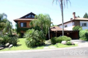 Casa em Condomínio à venda com 450m², 6 dormitórios, 4 suítes, 2 vagas, no bairro Terra Ville em Porto Alegre