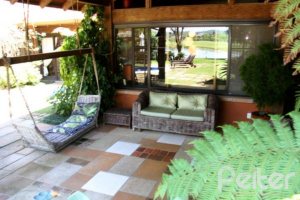 Casa em Condomínio à venda com 450m², 6 dormitórios, 4 suítes, 2 vagas, no bairro Terra Ville em Porto Alegre