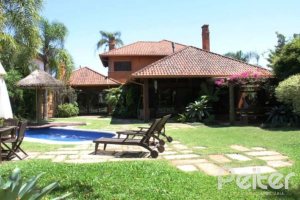 Casa em Condomínio à venda com 450m², 6 dormitórios, 4 suítes, 2 vagas, no bairro Terra Ville em Porto Alegre