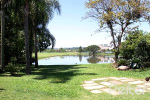 Casa em Condomínio à venda com 450m², 6 dormitórios, 4 suítes, 2 vagas, no bairro Terra Ville em Porto Alegre